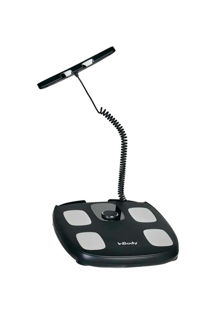 InBody Dial H30 home scale with four foot contacts and a connected hand-held electrode bar