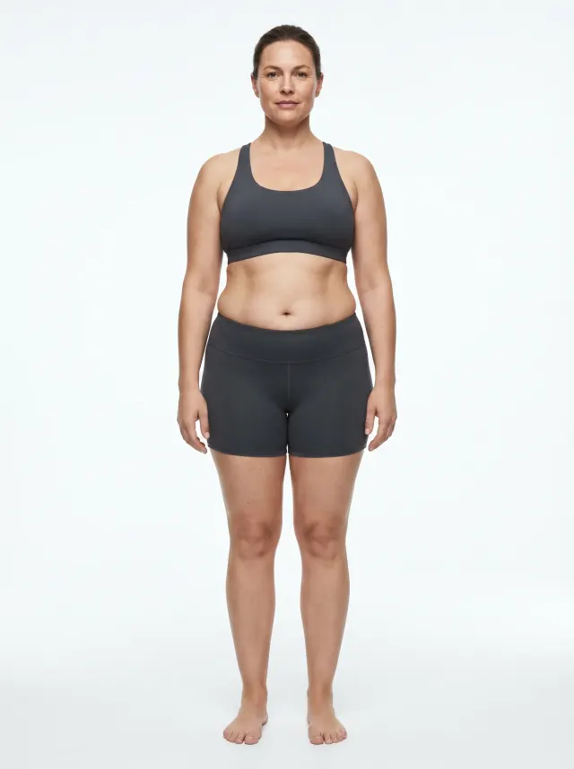 32 percent body fat female — reference physique with noticeable lower-body fat and a fuller midsection at the top of the average range