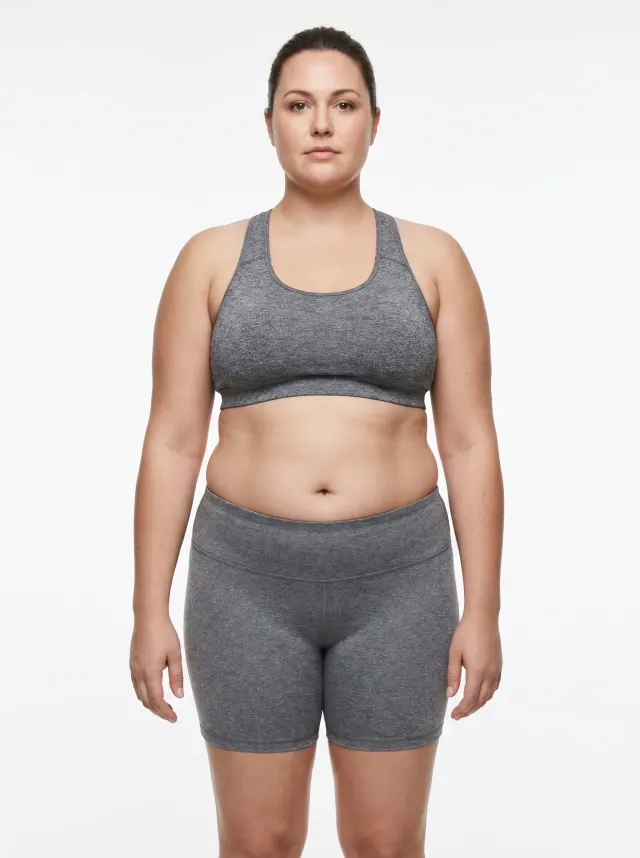42 percent body fat female — reference physique showing significant fat accumulation through the midsection, hips, and limbs