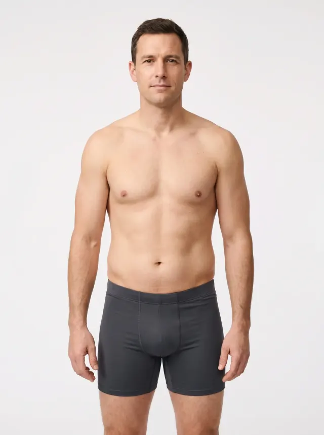 23 percent body fat male — reference physique showing a soft waist, early love handles, no visible ab definition, rounder face